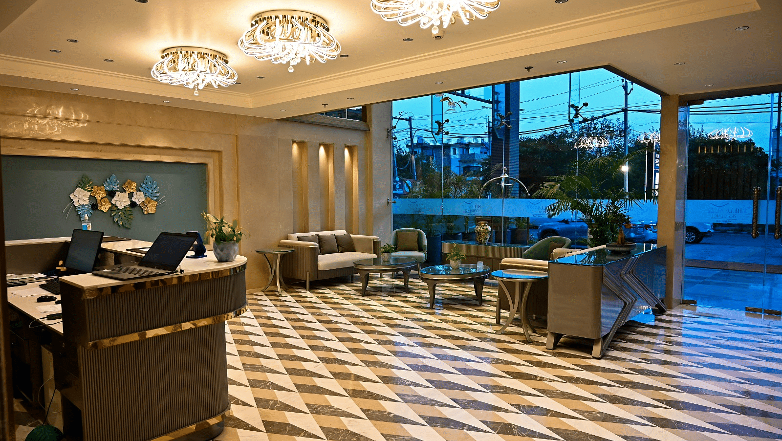 A spacious lobby featuring comfortable seating arrangements and a reception desk at 